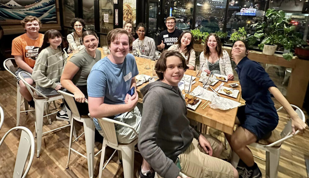 Young people at table in restaurant